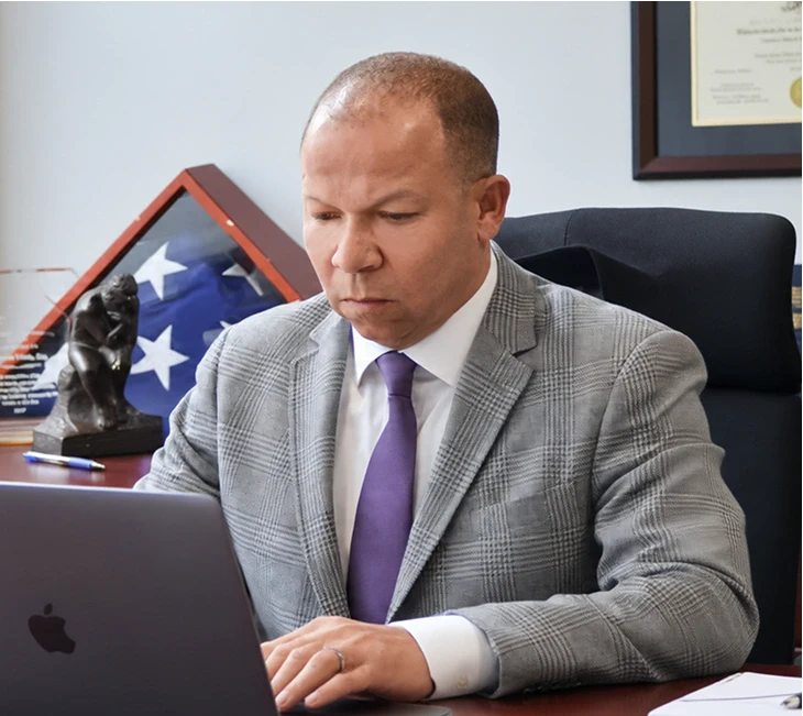 Attorney James White working at his desk